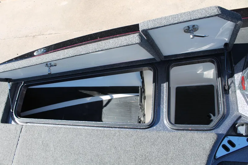 Slide: The Image of 2020 Ranger Z521L boat storage compartments open, showcasing interior space. - 9