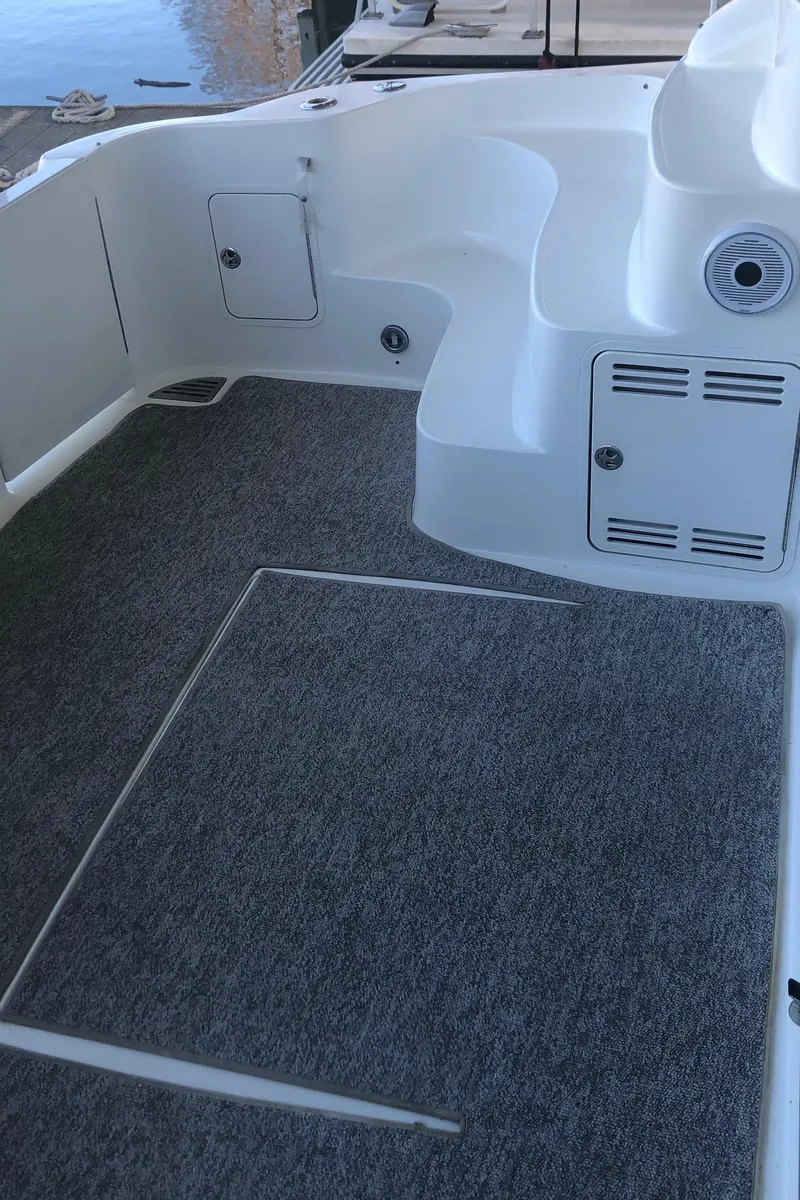 Slide: The Image of 2001 Sea Ray 400 Sedan Bridge boat deck with carpeted flooring. - 18