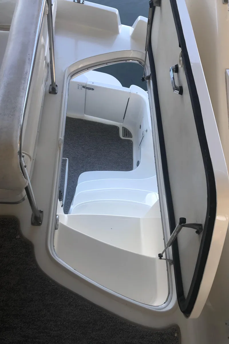 Slide: The Image of Stairway on 2001 Sea Ray 400 Sedan Bridge yacht, featuring sleek white design. - 21