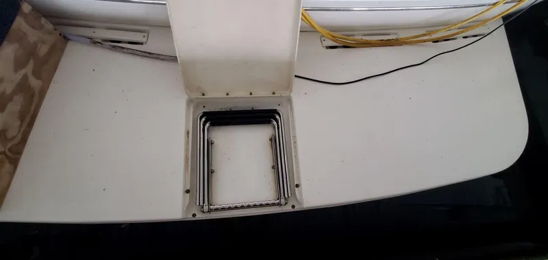 Slide: The Image of 2001 Sea Ray 400 Sedan Bridge swim platform with open hatch. - 29