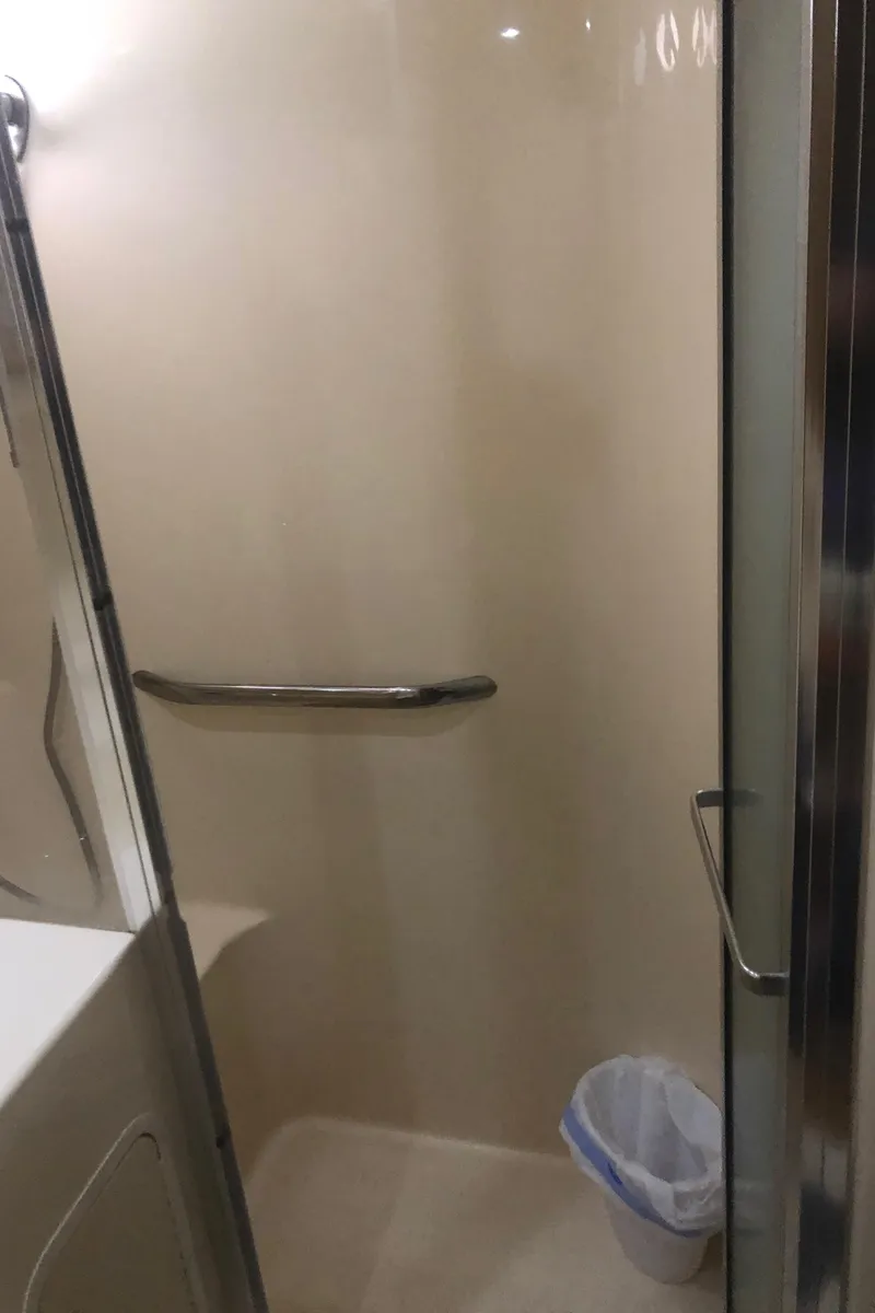 Slide: The Image of Shower area in 2001 Sea Ray 400 Sedan Bridge yacht bathroom. - 41