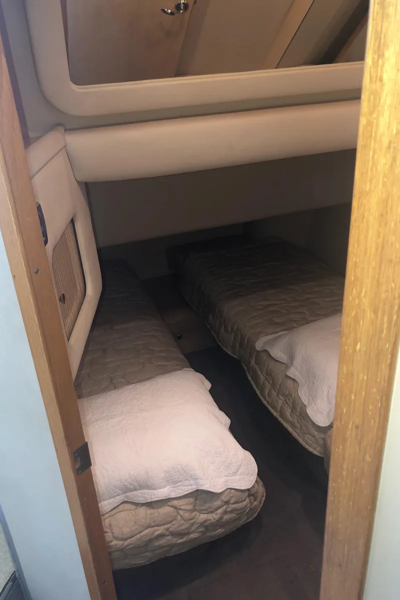 Slide: The Image of 2001 Sea Ray 400 Sedan Bridge cabin with twin beds and cozy interior. - 47