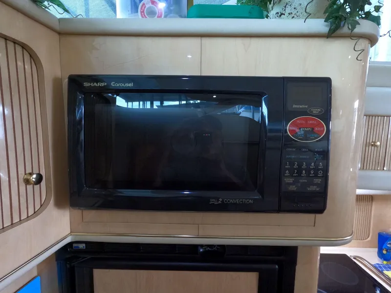 Slide: The Image of Sharp Carousel microwave in 2001 Sea Ray 400 Sedan Bridge kitchen. - 53
