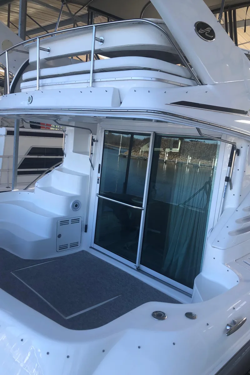 Slide: The Image of 2001 Sea Ray 400 Sedan Bridge yacht with spacious deck and sliding glass doors. - 6