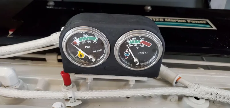 Slide: The Image of Engine gauges on a 2001 Sea Ray 400 Sedan Bridge boat. - 84
