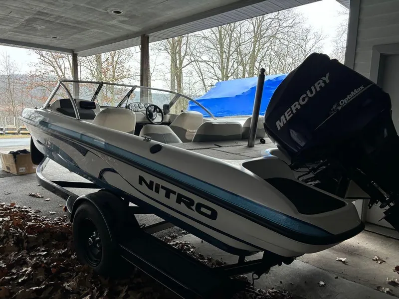 Slide: The Image of 2007 Nitro 189 Sport boat with Mercury engine under a covered area. - 12