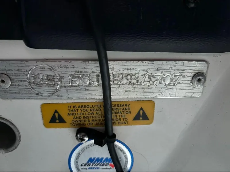 Slide: The Image of 2007 Nitro 189 Sport boat identification plate with safety warning label. - 13
