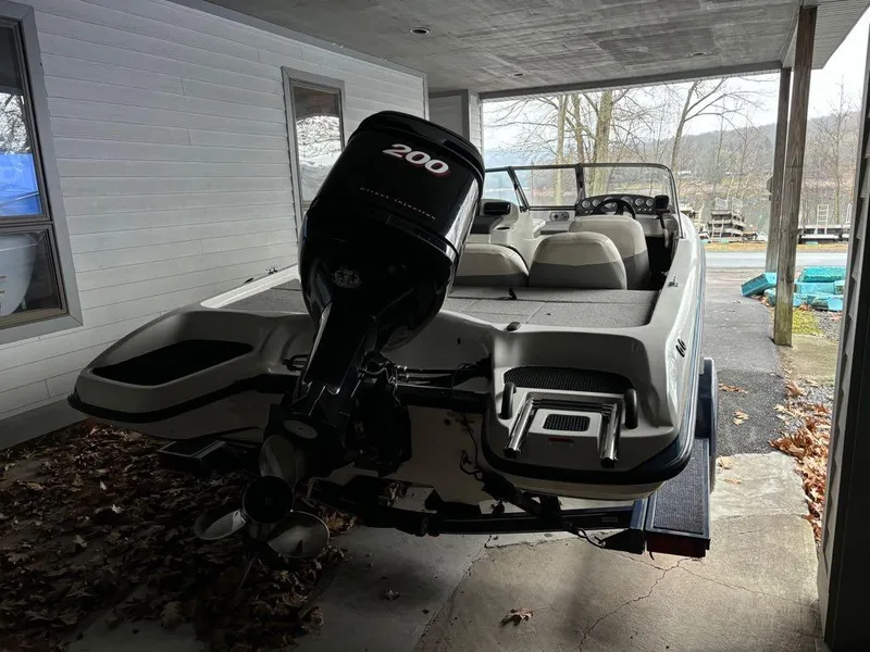 Slide: The Image of 2007 Nitro 189 Sport boat with 200 HP engine parked under a shelter. - 5