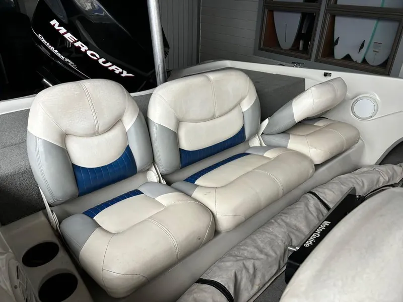 Slide: The Image of 2007 Nitro 189 Sport boat interior with cushioned seating and Mercury engine. - 7