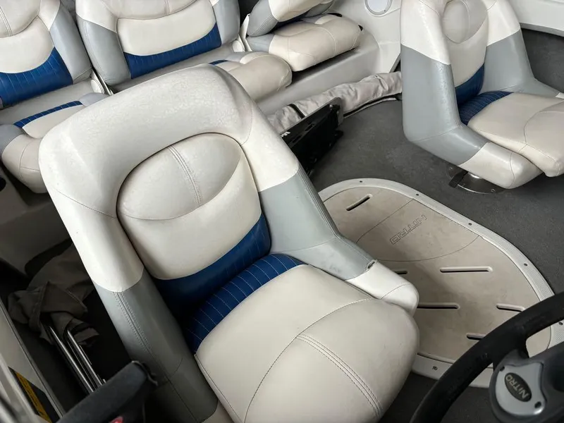 Slide: The Image of 2007 Nitro 189 Sport boat interior with white and blue seating. - 9