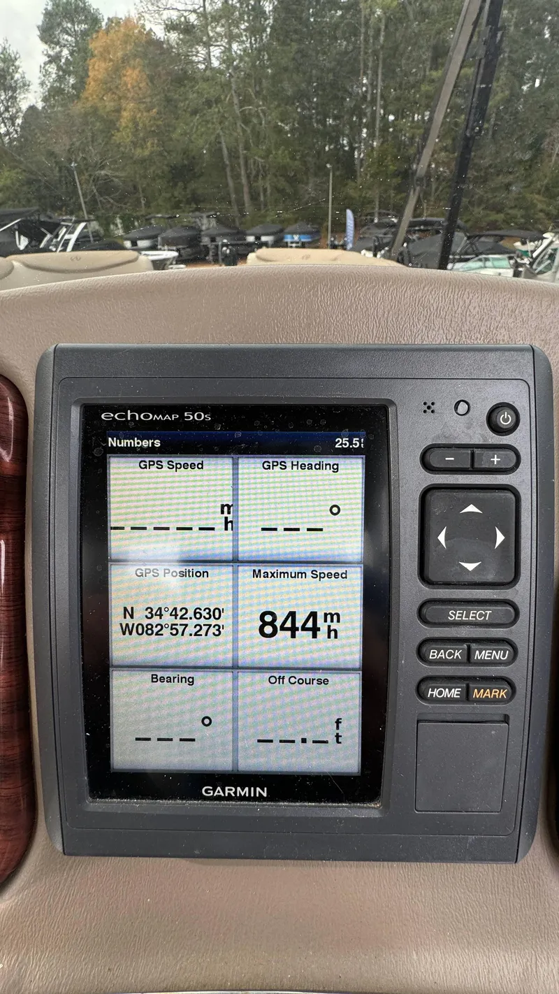 Slide: The Image of Garmin GPS display on Avalon 2785 Paradise boat, showing coordinates and speed. - 16