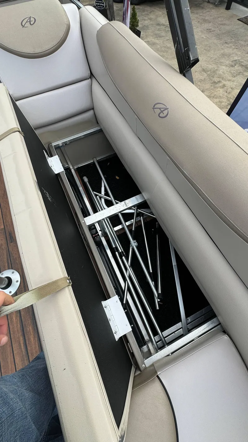 Slide: The Image of 2015 Avalon 2785 Paradise boat seat storage compartment with metal frame inside. - 23