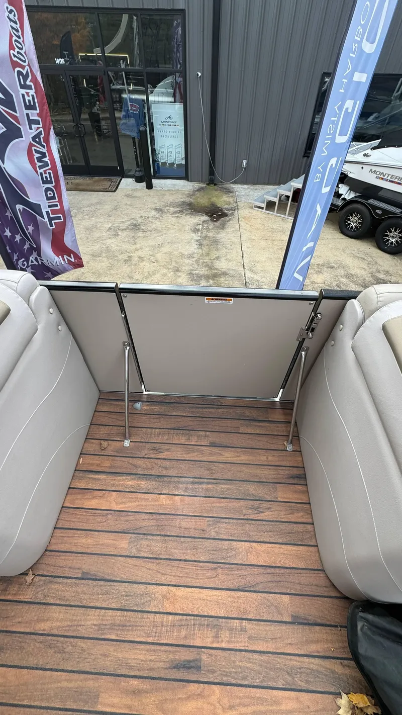 Slide: The Image of Avalon 2785 Paradise 2015 boat interior with wooden deck and open gate. - 26