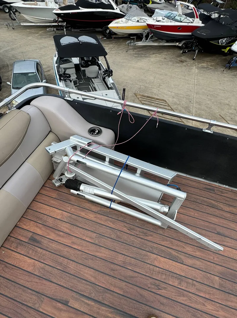 Slide: The Image of 2015 Avalon 2785 Paradise boat interior with folded ladder on deck. - 27