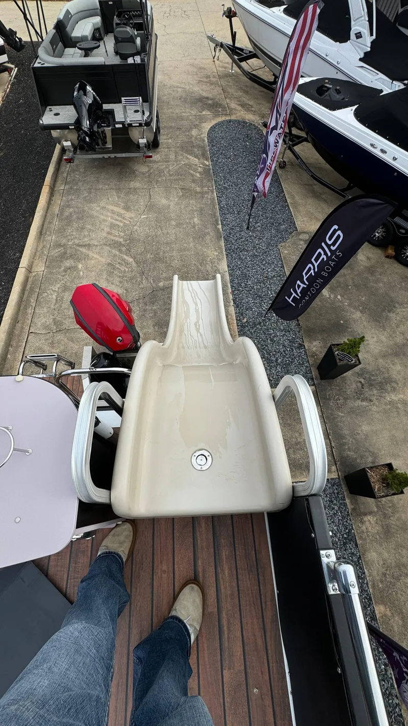 Slide: The Image of Avalon 2785 Paradise 2015 boat with slide, docked near other boats. - 30