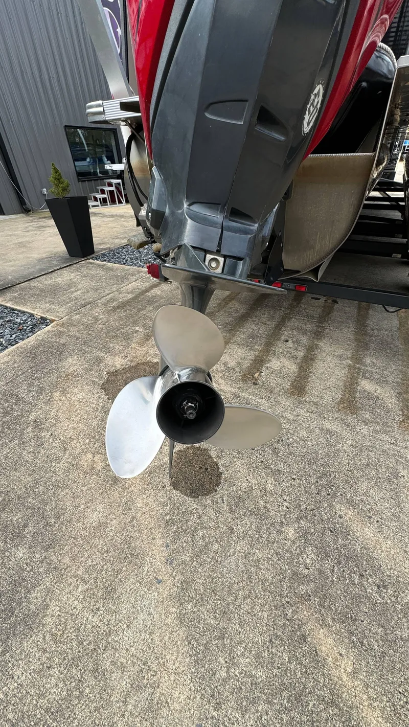 Slide: The Image of Close-up of 2015 Avalon 2785 Paradise boat propeller on concrete surface. - 36