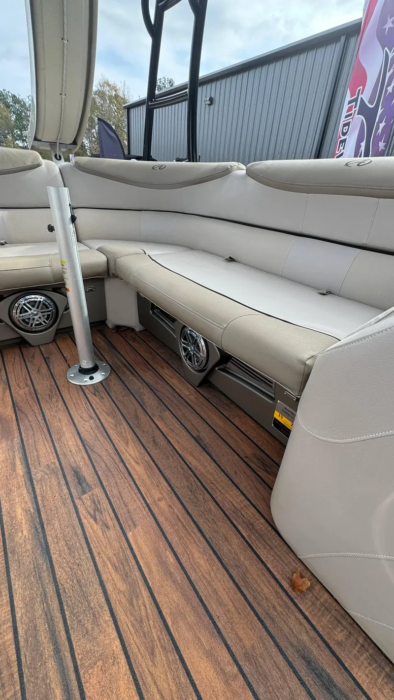 Slide: The Image of 2015 Avalon 2785 Paradise boat interior with wood flooring and cushioned seating. - 38