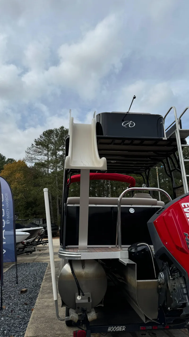 Slide: The Image of 2015 Avalon 2785 Paradise pontoon boat with slide and Evinrude motor. - 6