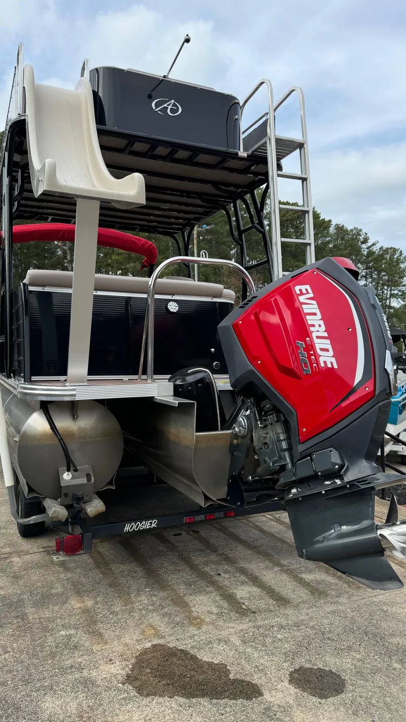 Slide: The Image of 2015 Avalon 2785 Paradise pontoon boat with Evinrude motor and slide. - 8
