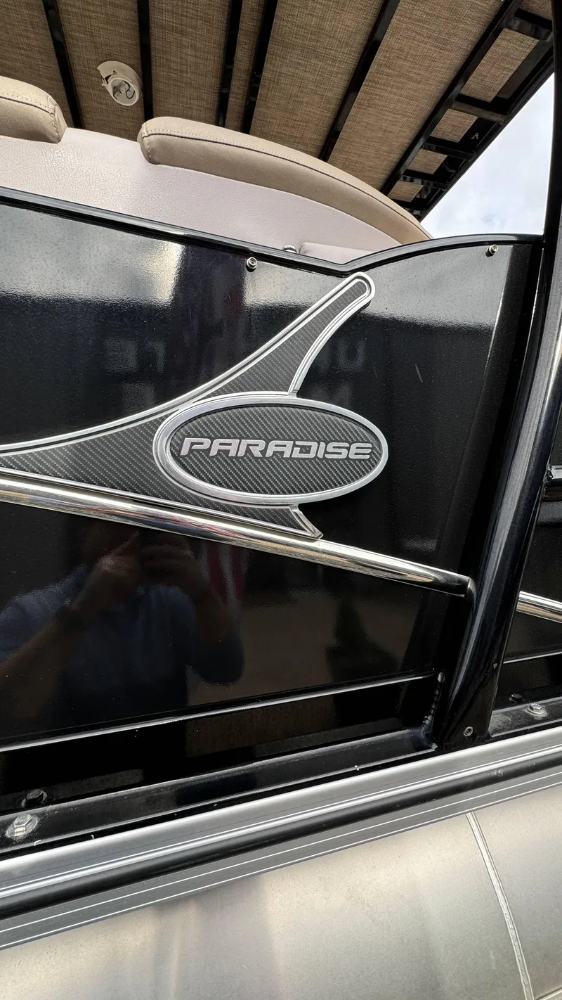 Slide: The Image of 2015 Avalon 2785 Paradise boat, sleek black design with logo detail. - 9