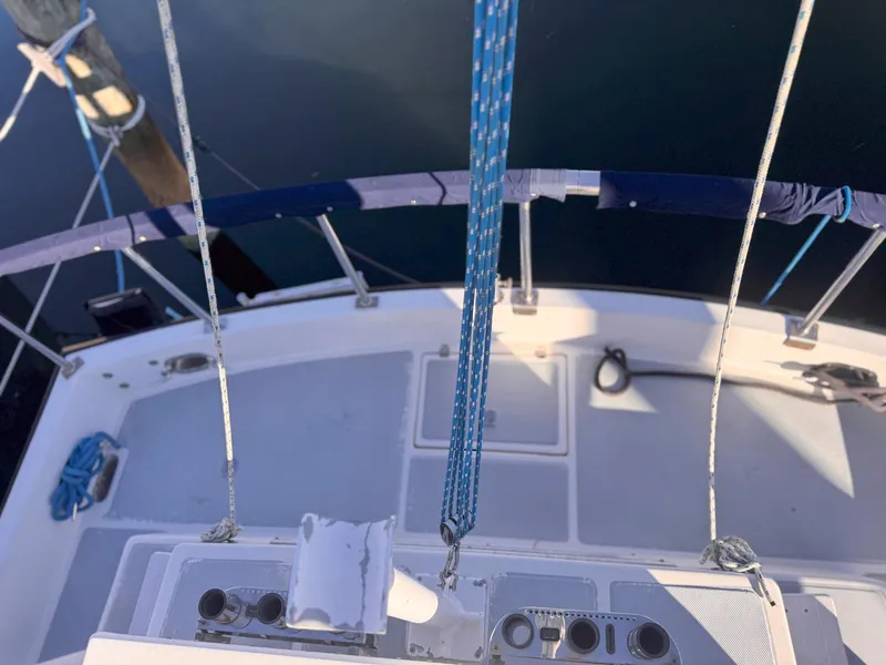 Slide: The Image of Monk 36 Trawler 1999 deck view with ropes and railing. - 10