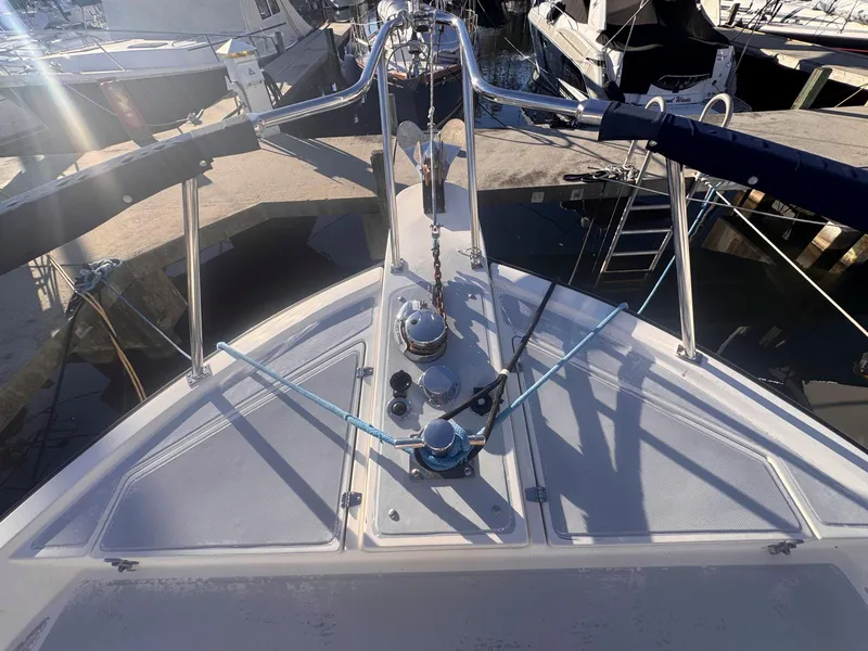 Slide: The Image of Bow view of 1999 Monk 36 Trawler docked at marina. - 12