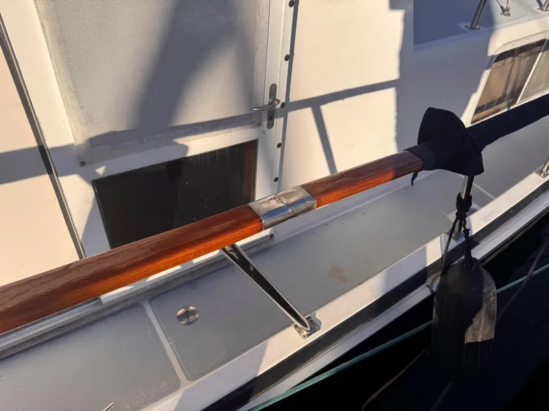 Slide: The Image of Monk 36 Trawler 1999, wooden handrail detail, docked in sunlight. - 13