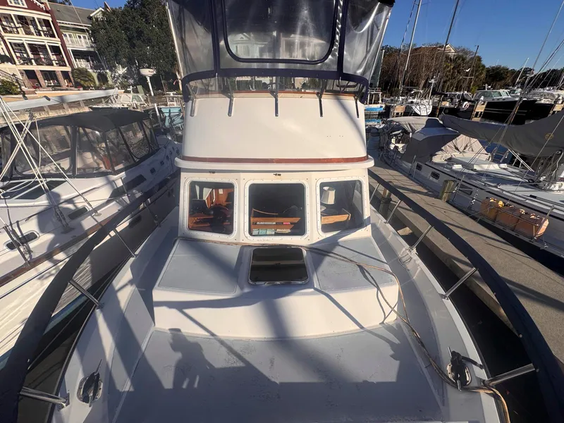 Slide: The Image of 1999 Monk 36 Trawler docked at marina, front deck view. - 3