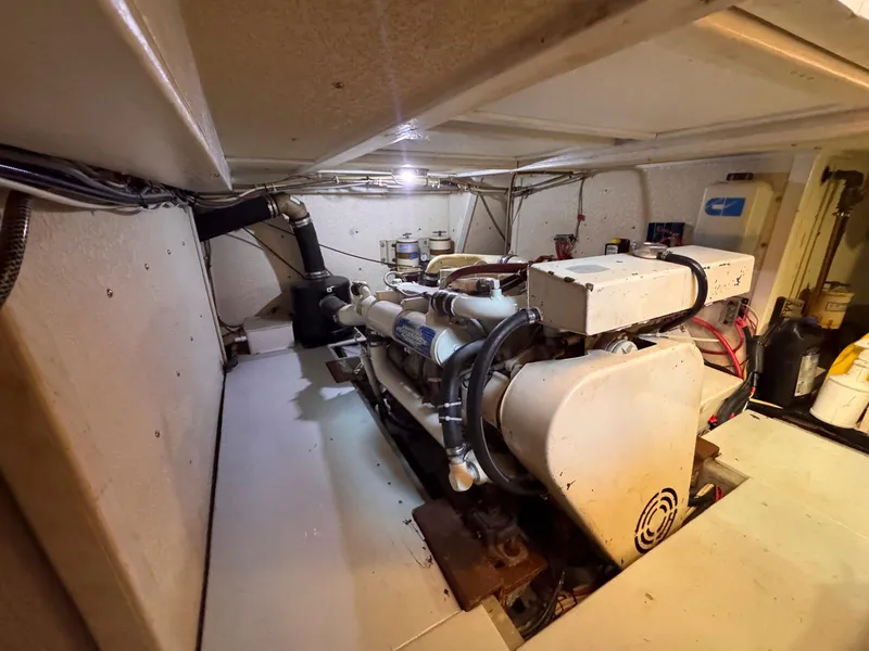 Slide: The Image of Engine room of 1999 Monk 36 Trawler with visible machinery and equipment. - 37