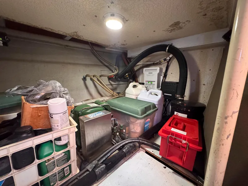 Slide: The Image of Engine room of 1999 Monk 36 Trawler with storage containers and equipment. - 38