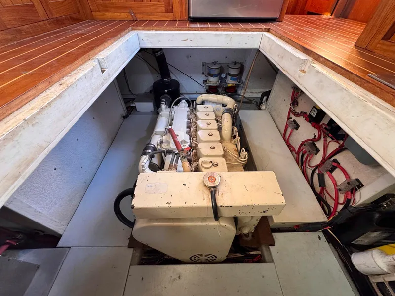 Slide: The Image of Engine room of 1999 Monk 36 Trawler with visible engine and wiring. - 41