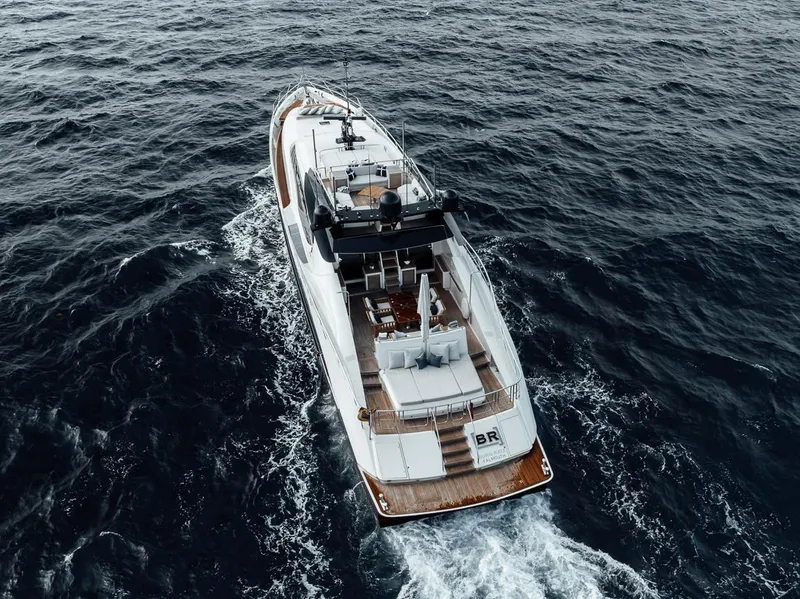 Slide: The Image of Luxury 2006 Palmer Johnson Express yacht cruising on open sea. - 19