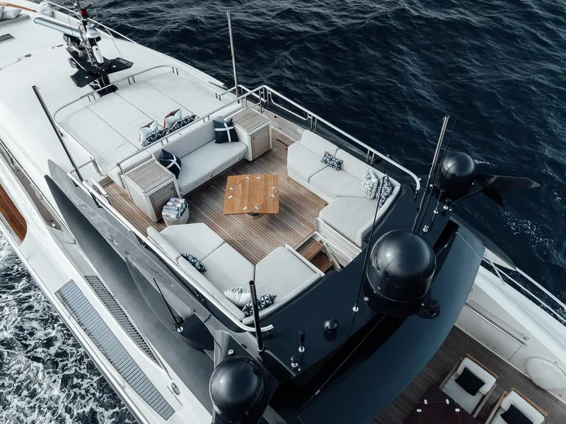 Slide: The Image of Luxurious 2006 Palmer Johnson Express yacht with elegant deck seating, cruising on open water. - 29