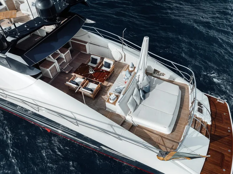Slide: The Image of Luxurious 2006 Palmer Johnson Express yacht with elegant deck seating and ocean backdrop. - 33