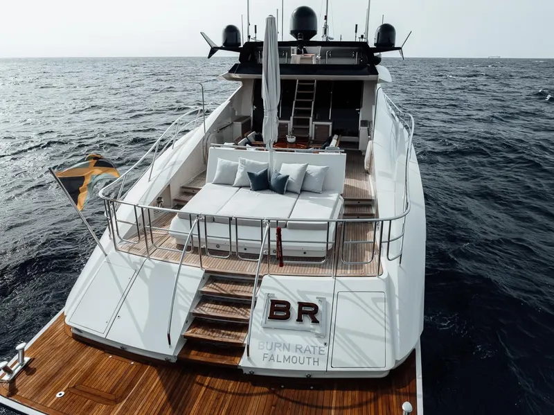 Slide: The Image of Luxury 2006 Palmer Johnson Express yacht on open sea, featuring spacious deck and elegant design. - 35