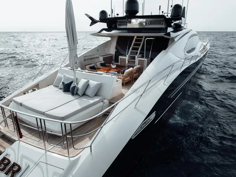 Slide: The Image of Luxurious 2006 Palmer Johnson Express yacht cruising on open sea, featuring elegant deck design. - 36