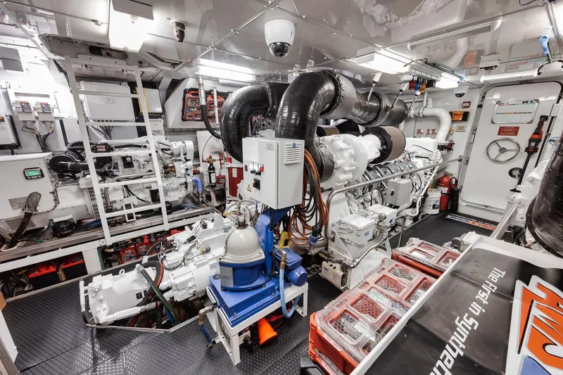 Slide: The Image of Engine room of a 2006 Palmer Johnson Express yacht, showcasing machinery and equipment. - 44