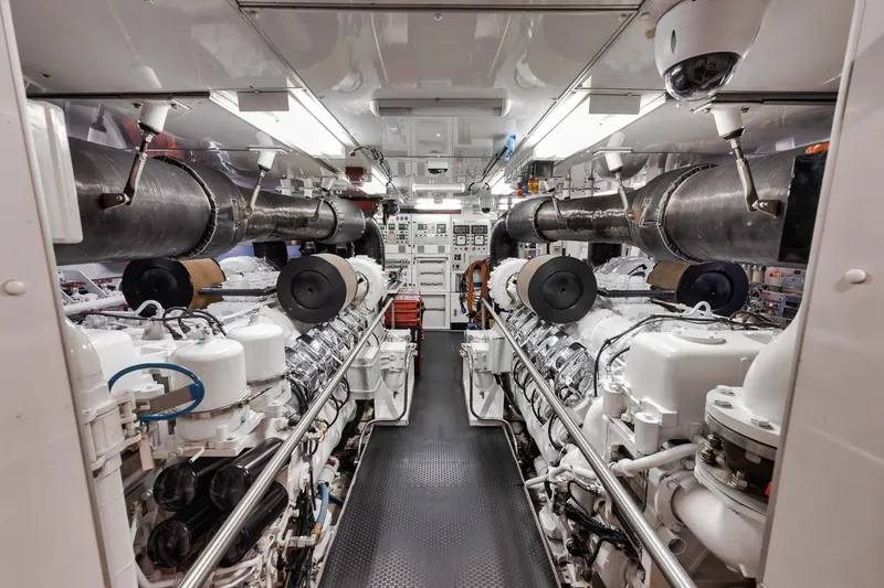 Slide: The Image of Engine room of a 2006 Palmer Johnson Express yacht, showcasing machinery and equipment. - 47