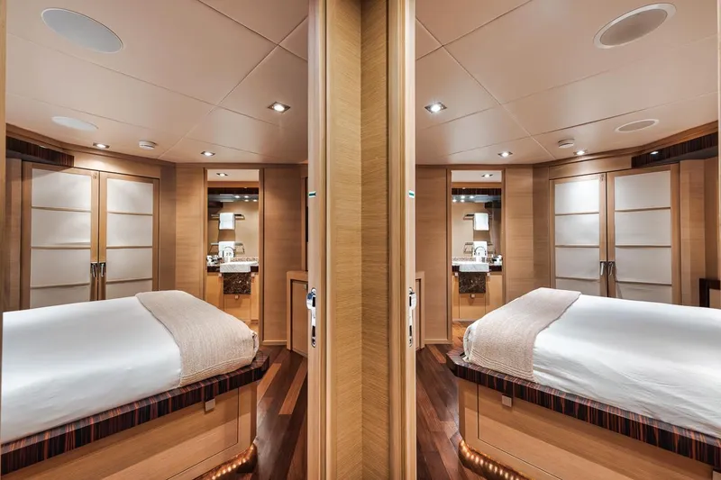 Slide: The Image of Luxurious 2006 Palmer Johnson Express yacht cabin with elegant wood finishes and modern amenities. - 48
