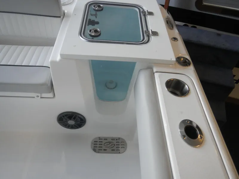Slide: The Image of 2024 Sea Fox 228 Commander boat interior with seating and storage compartments. - 13