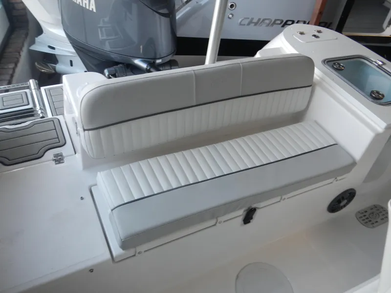 Slide: The Image of 2024 Sea Fox 228 Commander boat interior with cushioned seating and Yamaha engine. - 16