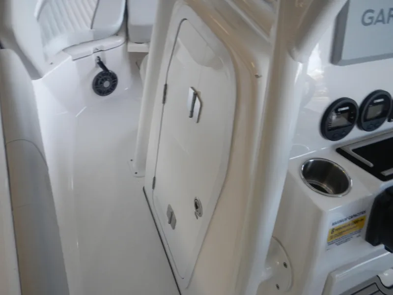 Slide: The Image of 2024 Sea Fox 228 Commander boat interior with console and seating area. - 5
