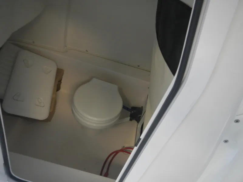 Slide: The Image of 2024 Sea Fox 228 Commander boat interior with compact marine toilet. - 6
