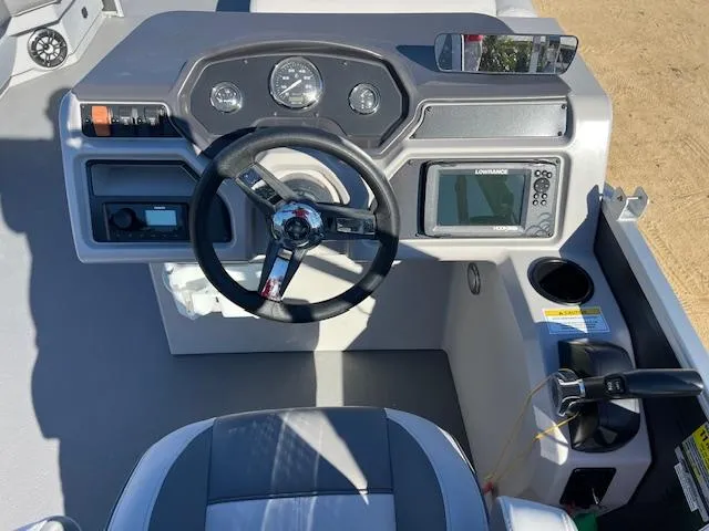 Slide: The Image of 2022 Godfrey Sweetwater 2086 F boat dashboard with steering wheel and navigation controls. - 5