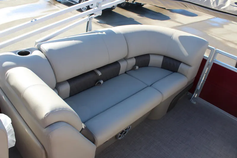 Slide: The Image of 2025 Sun Tracker Party Barge 22 DLX, beige seating, spacious deck, luxury pontoon boat. - 15
