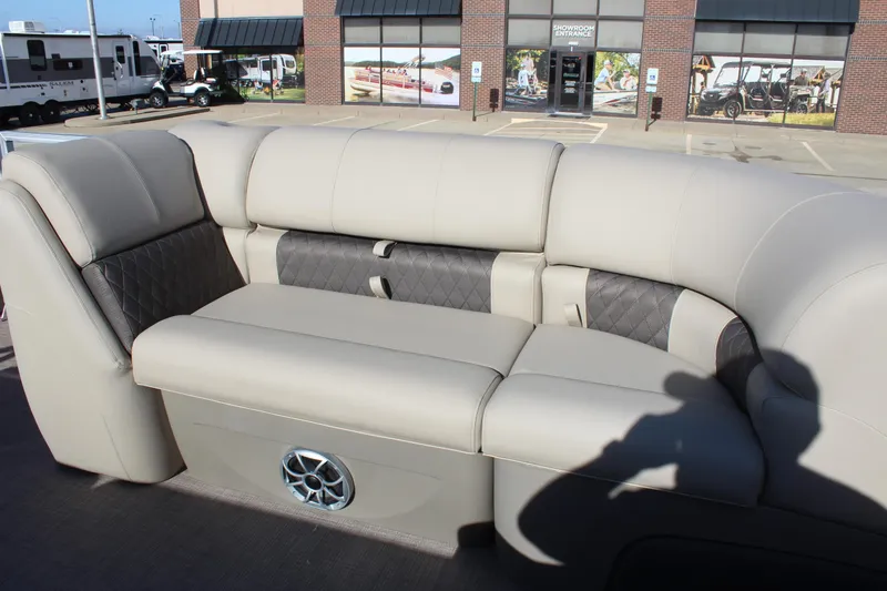 Slide: The Image of 2025 Sun Tracker Party Barge 22 DLX interior seating with modern design and speaker system. - 8