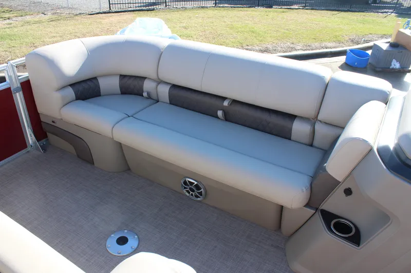 Slide: The Image of 2025 Sun Tracker Party Barge 22 DLX interior seating, beige upholstery, spacious layout. - 9