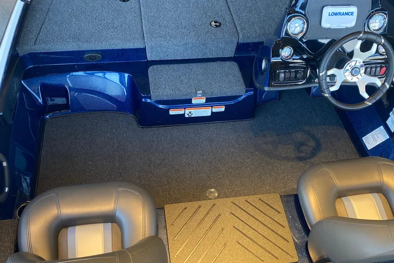 Slide: The Image of Interior of 2025 Nitro Z17 boat featuring steering wheel and seating area. - 2