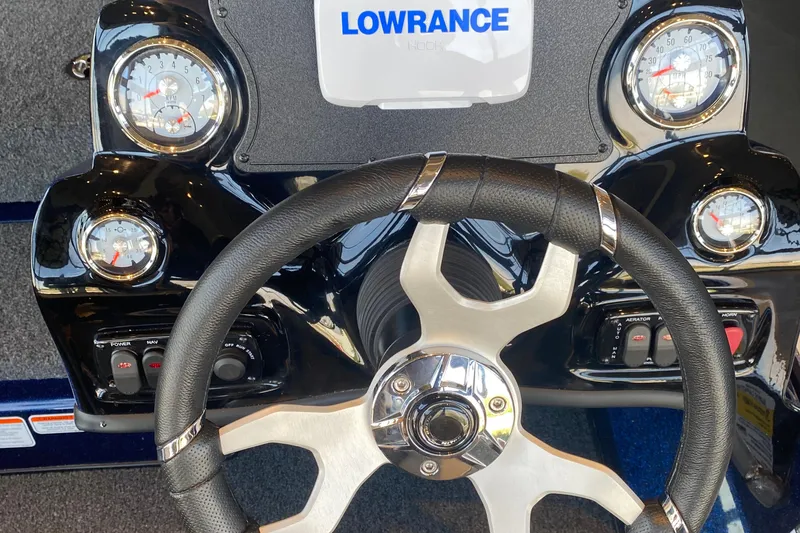 Slide: The Image of Steering wheel and dashboard of 2025 Nitro Z17 boat with gauges and Lowrance display. - 3