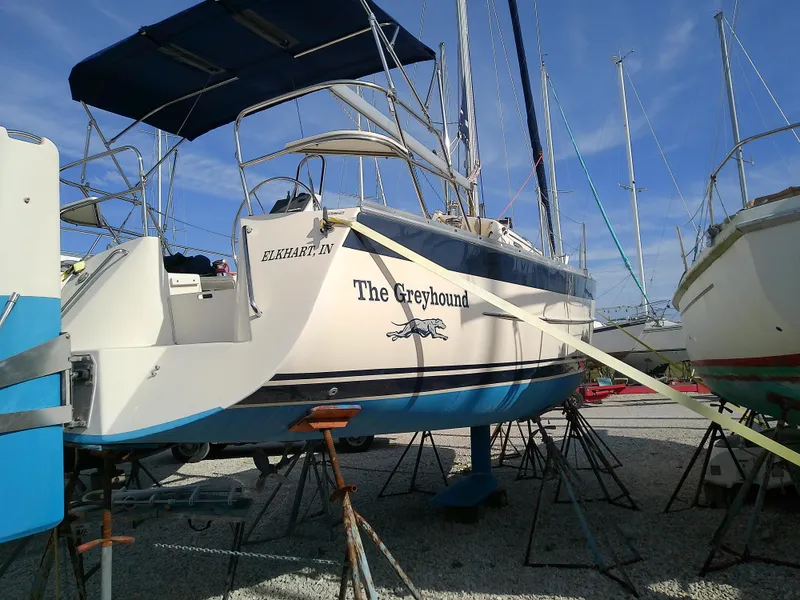 Slide: The Image of 2017 Hake Seaward 32RK sailboat "The Greyhound" on dry dock, blue and white hull. - 11